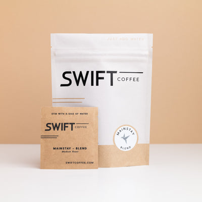 Swift Coffee Mainstay Blend instant coffee pouch with a labeled Mainstay Blend single-serve sachet in front
