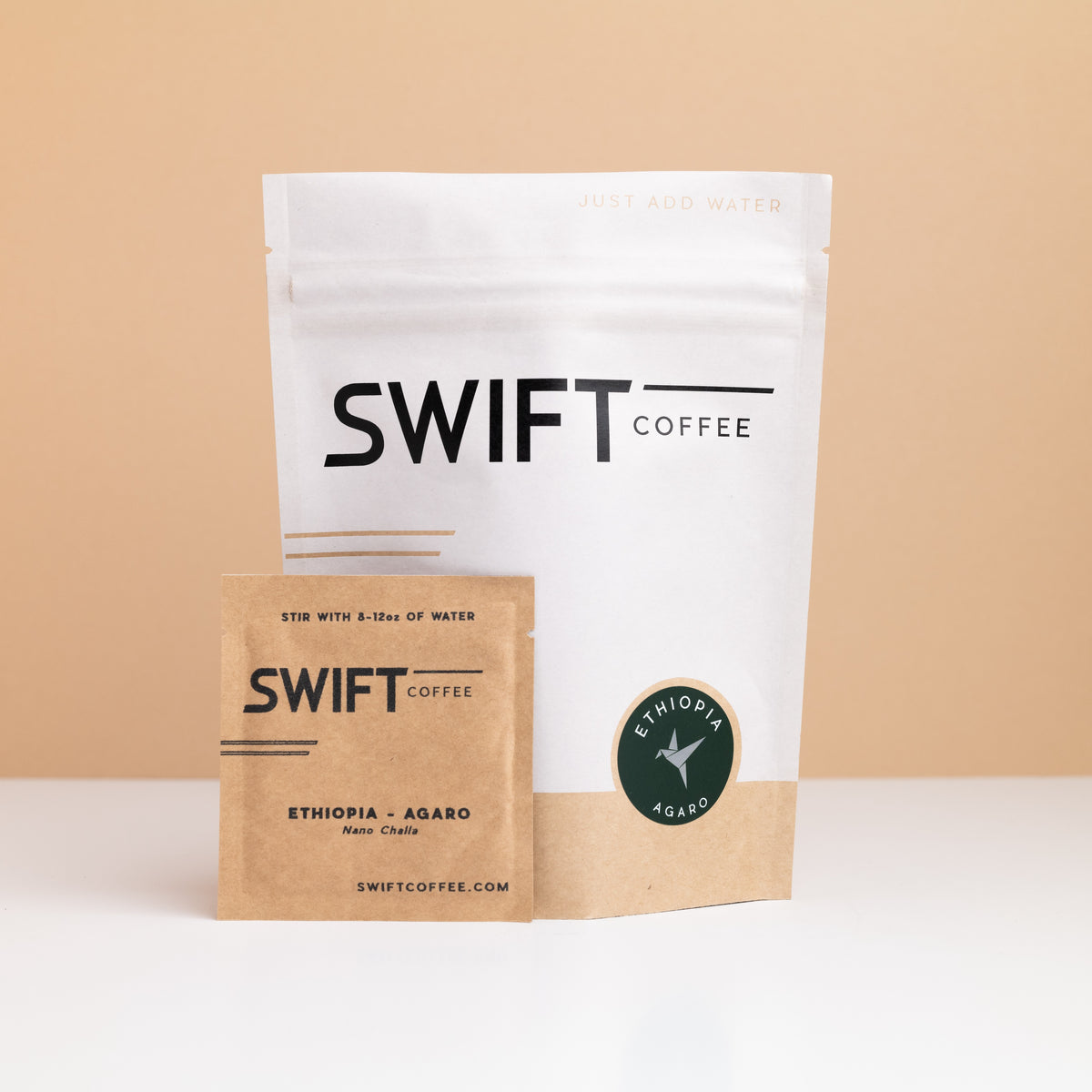 Swift Coffee Ethiopia Agaro instant coffee pouch with a labeled Ethiopia Agaro single-serve sachet in front