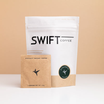 Swift Coffee Ethiopia Agaro instant coffee pouch with a kraft single-serve sachet in front