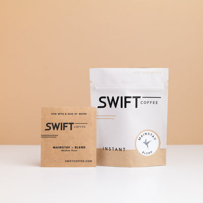Swift Coffee Mainstay Blend instant coffee pouch with a labeled Mainstay Blend single-serve sachet in front
