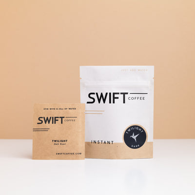 Swift Coffee Twilight Dark Roast instant coffee pouch with a labeled Twilight Dark Roast single-serve sachet in front