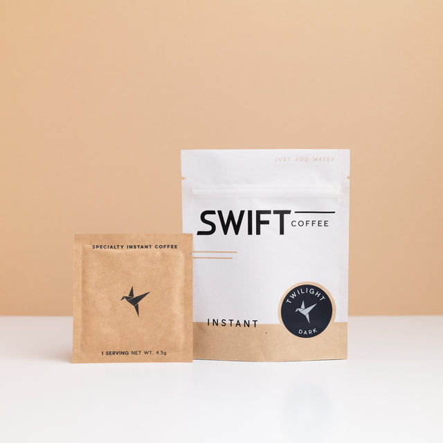 Swift Coffee Twilight Dark Roast instant coffee: white pouch with a navy Twilight label and a kraft single-serve sachet