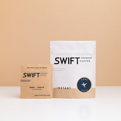 Swift Coffee Peru Cusco instant coffee pouch with a labeled Peru Cusco single-serve sachet in front