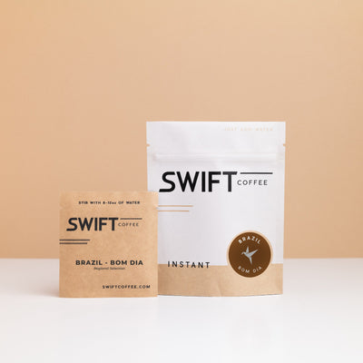 Swift Coffee Brazil Bom Dia instant coffee pouch with a labeled Brazil Bom Dia single-serve sachet in front
