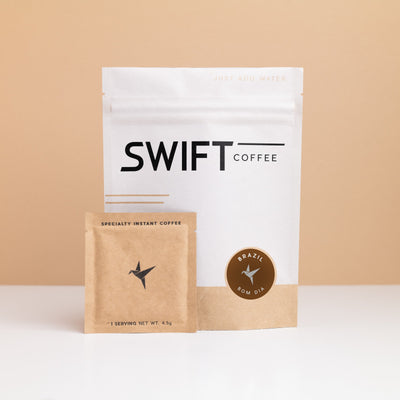 Swift Coffee Brazil Bom Dia instant coffee pouch with a kraft single-serve sachet in front