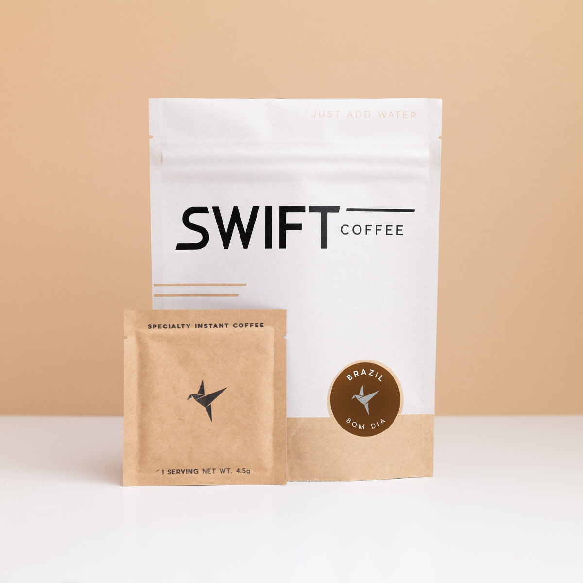 Swift Coffee Brazil Bom Dia instant coffee pouch with a kraft single-serve sachet in front