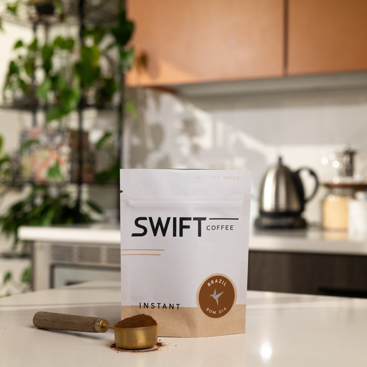 Swift Coffee Brazil Bom Dia instant coffee, 25-cup bulk pouch, on a kitchen counter