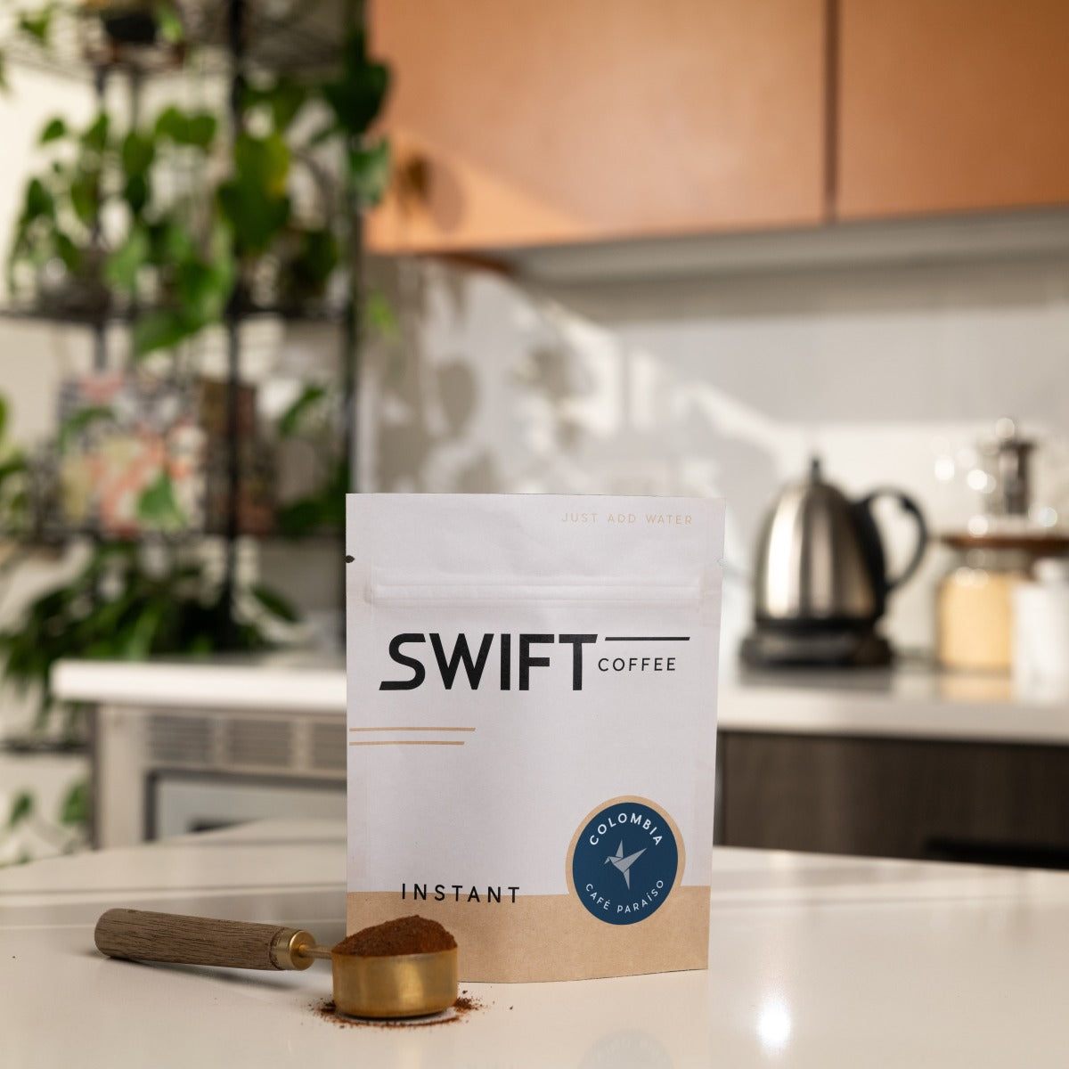 Swift Coffee Colombia Cafe Paraiso instant coffee, 25-cup bulk pouch, on a kitchen counter