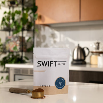 Swift Coffee Colombia Cafe Paraiso instant coffee, 25-cup bulk pouch, on a kitchen counter