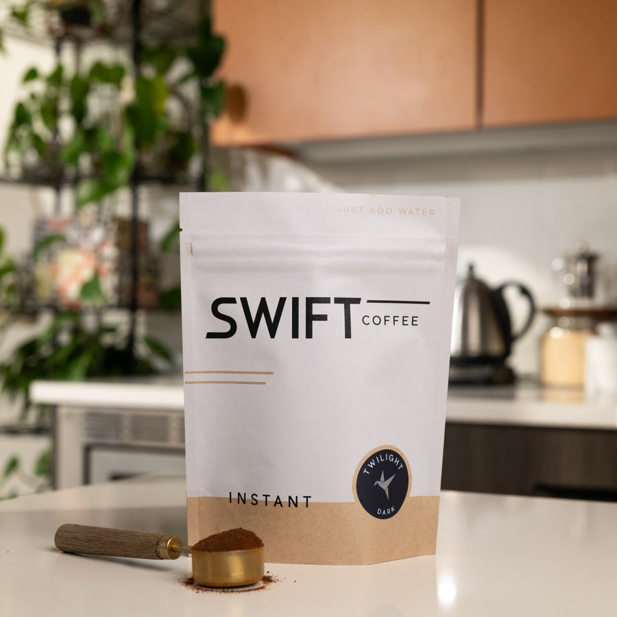 Swift Coffee Twilight Dark Roast instant coffee, 50-cup bulk pouch, on a kitchen counter