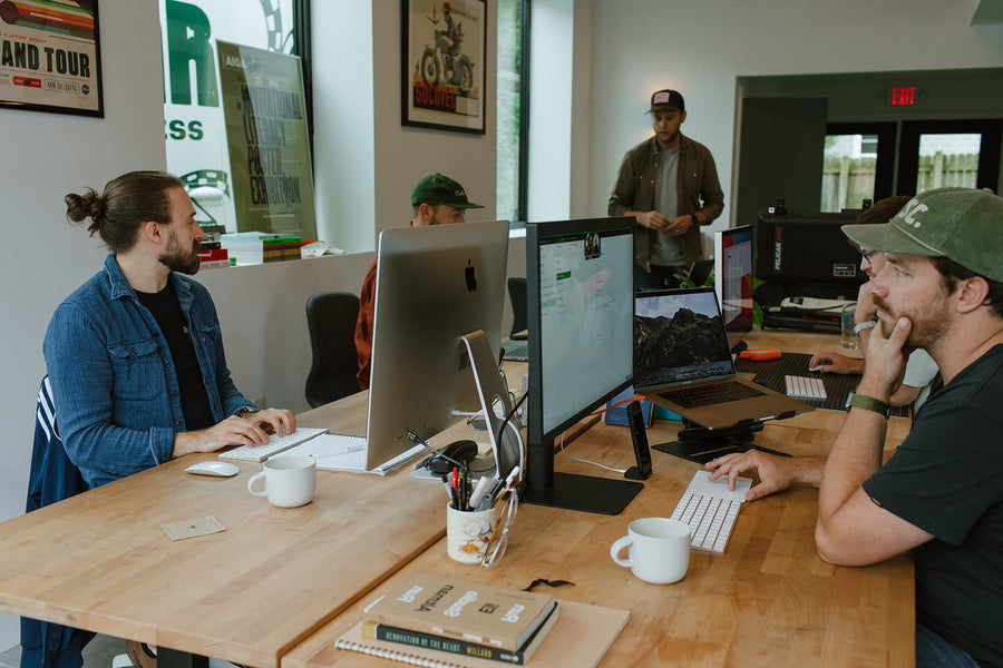 Team working at desks with Swift coffee mugs
