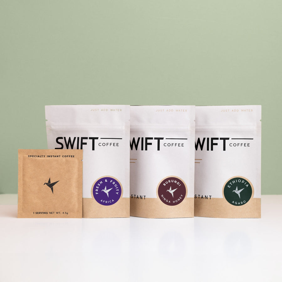 Swift Coffee East Africa Trio instant coffee pouches on a sage background